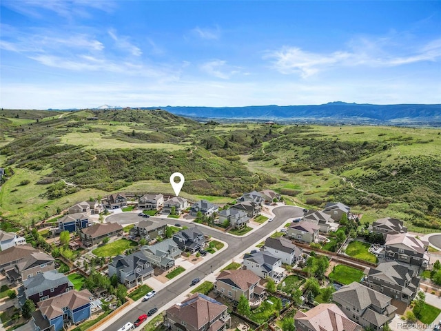 1133 Lucky Ct, Castle Rock, CO 80109 - aerial view of property's location with nearby suburban area and a mountainous background