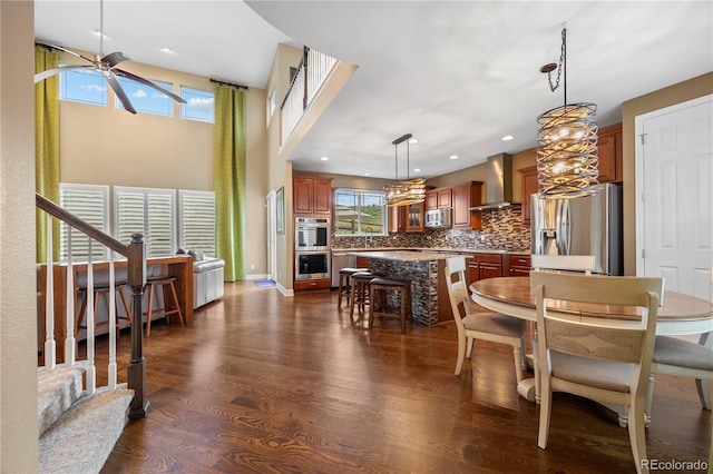 1133 Lucky Ct, Castle Rock, CO 80109 - dining area featuring a ceiling fan, dark wood-style flooring, recessed lighting, and stairway