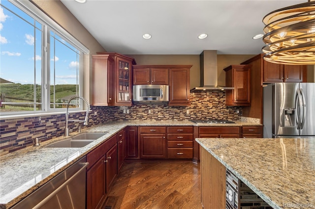 1133 Lucky Ct, Castle Rock, CO 80109 - kitchen with stainless steel appliances, wall chimney exhaust hood, a sink, dark wood-style floors, and light stone countertops