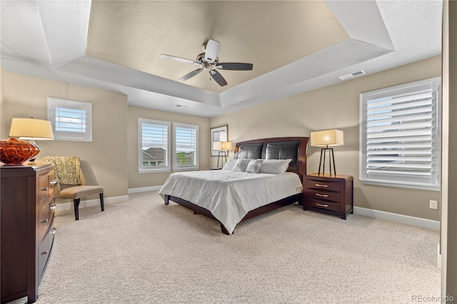 1133 Lucky Ct, Castle Rock, CO 80109 - bedroom with a raised ceiling, baseboards, light colored carpet, and a ceiling fan