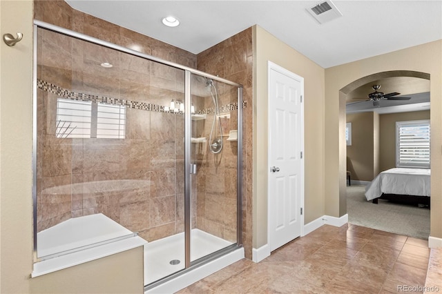 1133 Lucky Ct, Castle Rock, CO 80109 - full bathroom featuring a shower stall, ensuite bath, ceiling fan, and baseboards