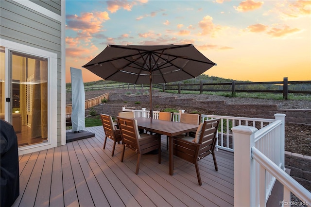 1133 Lucky Ct, Castle Rock, CO 80109 - deck at dusk featuring outdoor dining space and a fenced backyard