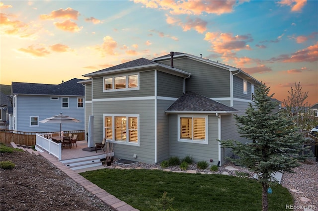 1133 Lucky Ct, Castle Rock, CO 80109 - rear view of house featuring a deck, a yard, and a shingled roof