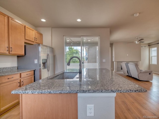 8018 Williams Fork Ave, Littleton, CO 80125 - kitchen featuring a sink, light wood-style floors, ceiling fan, stone counters, and recessed lighting
