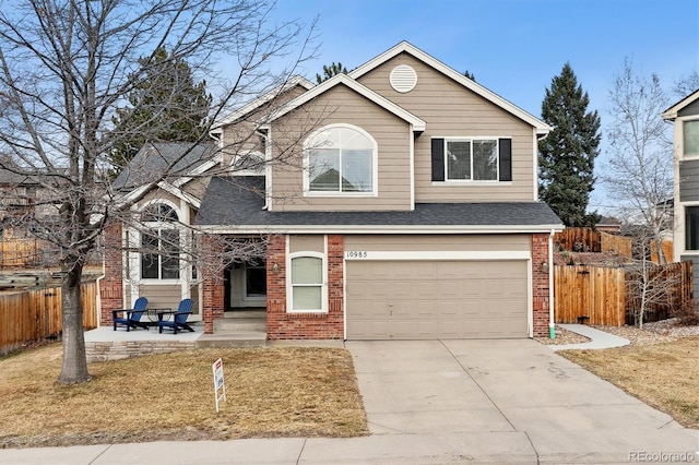 front of property featuring a garage and a patio area