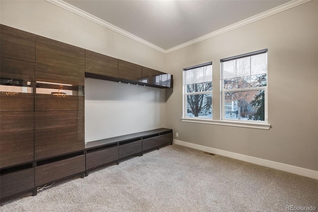 carpeted spare room with ornamental molding