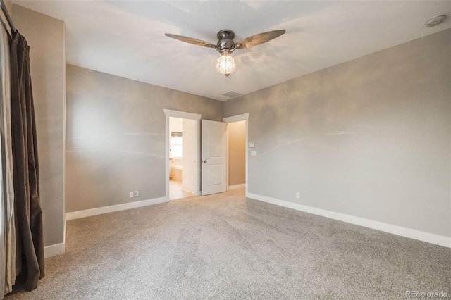 unfurnished bedroom with ceiling fan, connected bathroom, and light carpet