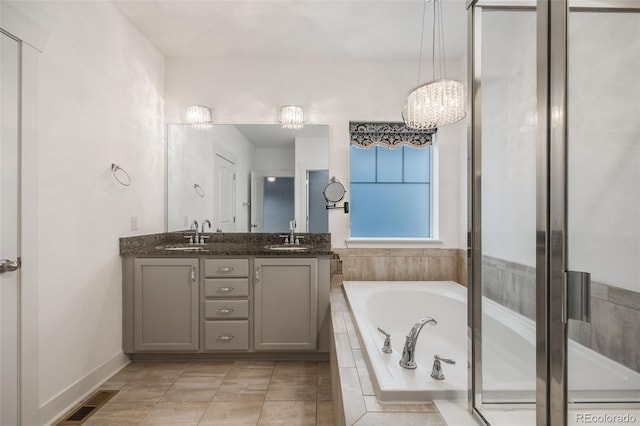 bathroom featuring tile patterned flooring, vanity, and independent shower and bath