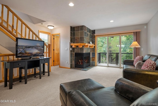 129 Logger Ln, Winter Park, CO 80482 - carpeted living area with a fireplace, recessed lighting, and stairs