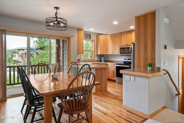 129 Logger Ln, Winter Park, CO 80482 - dining space with light wood-style floors, recessed lighting, and a chandelier