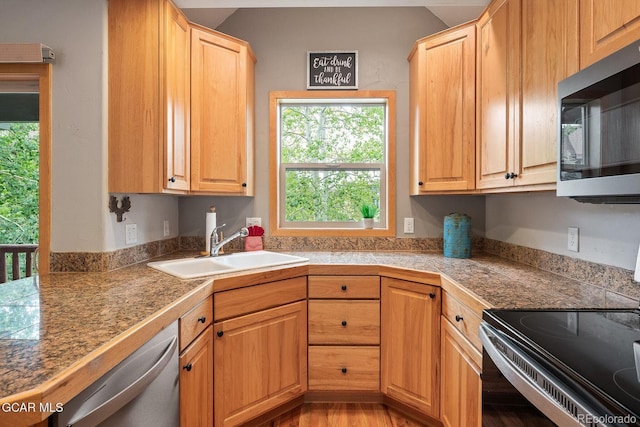 129 Logger Ln, Winter Park, CO 80482 - kitchen featuring tile countertops, stainless steel appliances, plenty of natural light, and light wood-style flooring