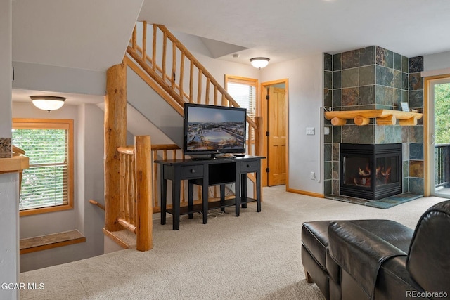 129 Logger Ln, Winter Park, CO 80482 - living room with carpet flooring and a tiled fireplace
