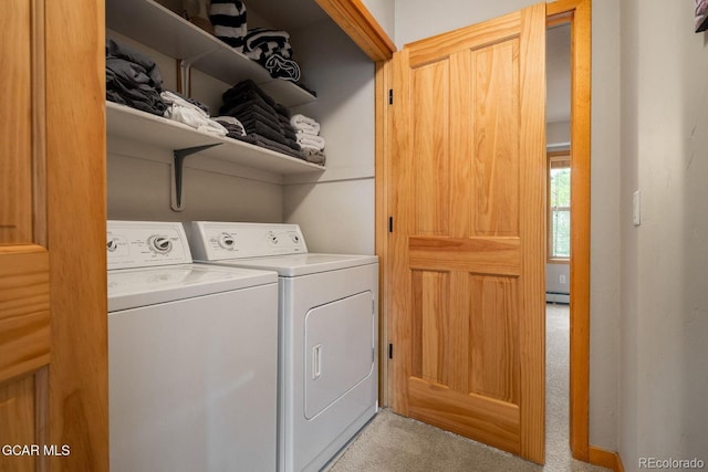 129 Logger Ln, Winter Park, CO 80482 - laundry room featuring light carpet, washing machine and dryer, and a baseboard heating unit