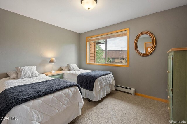 129 Logger Ln, Winter Park, CO 80482 - carpeted bedroom with a baseboard radiator and baseboards