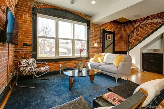 2801 Champa St, Denver, CO 80205 - living room with brick wall and wood finished floors