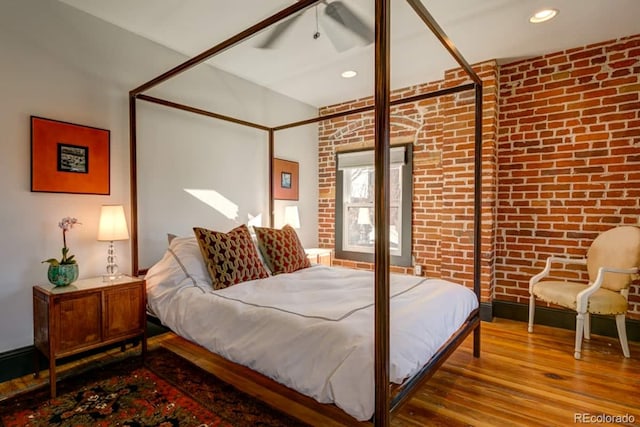 2801 Champa St, Denver, CO 80205 - bedroom with wood finished floors, brick wall, recessed lighting, and ceiling fan