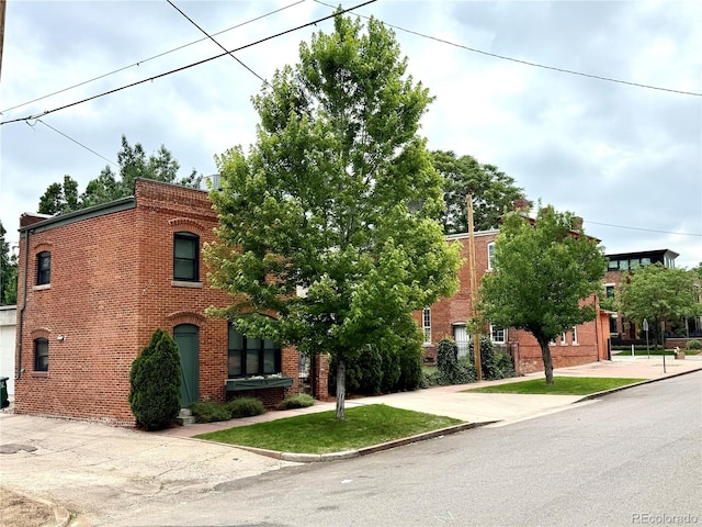 2801 Champa St, Denver, CO 80205 - view of front facade featuring brick siding
