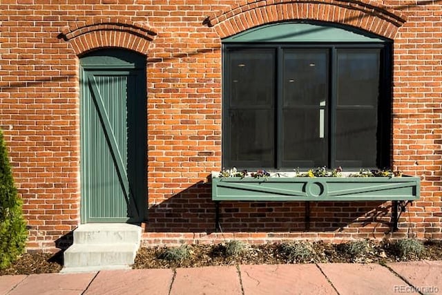 2801 Champa St, Denver, CO 80205 - doorway to property with brick siding