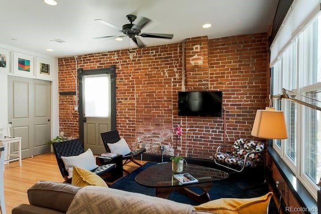 2801 Champa St, Denver, CO 80205 - living area featuring brick wall, ceiling fan, wood finished floors, and recessed lighting