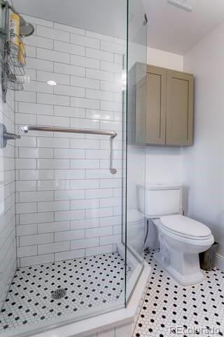 2801 Champa St, Denver, CO 80205 - bathroom with a stall shower and tile patterned floors