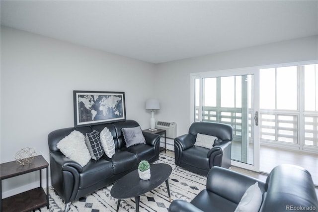 living room featuring a wall unit AC