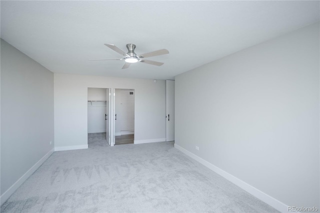 unfurnished bedroom featuring light carpet, a closet, and ceiling fan