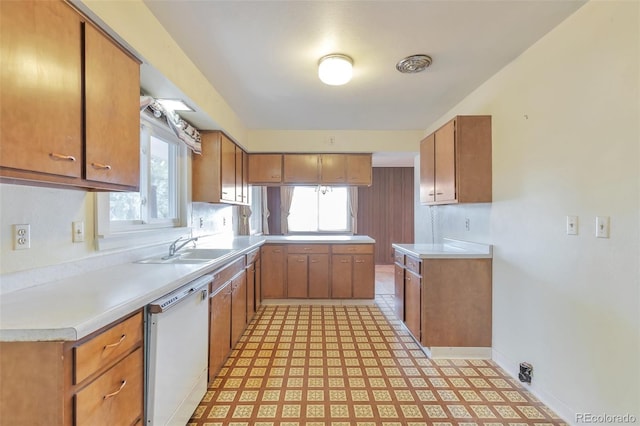 kitchen featuring sink and white dishwasher