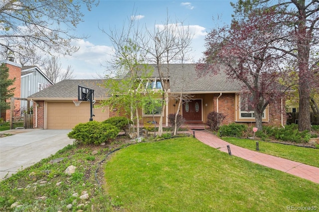 8424 E Otero Cir, Centennial, CO 80112 - view of front of house with an attached garage, concrete driveway, a front yard, brick siding, and roof with shingles
