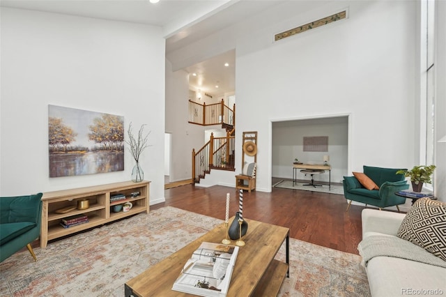 8424 E Otero Cir, Centennial, CO 80112 - living area featuring a high ceiling, wood finished floors, stairs, recessed lighting, and baseboards