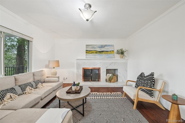 8424 E Otero Cir, Centennial, CO 80112 - living room featuring wood finished floors, a high end fireplace, and crown molding