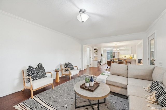 8424 E Otero Cir, Centennial, CO 80112 - living room with a chandelier, ornamental molding, wood finished floors, and baseboards