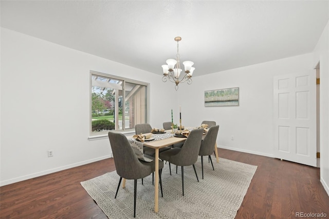 8424 E Otero Cir, Centennial, CO 80112 - dining space featuring a chandelier, baseboards, and dark wood finished floors