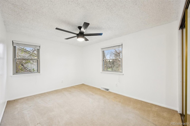8424 E Otero Cir, Centennial, CO 80112 - unfurnished room featuring carpet floors, a textured ceiling, a ceiling fan, and baseboards