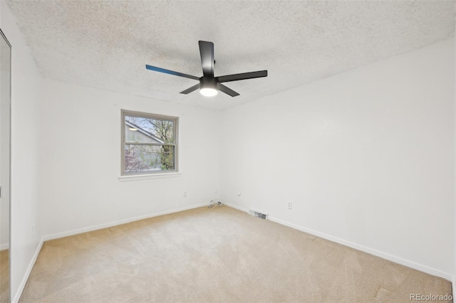8424 E Otero Cir, Centennial, CO 80112 - empty room featuring carpet flooring, ceiling fan, baseboards, and a textured ceiling