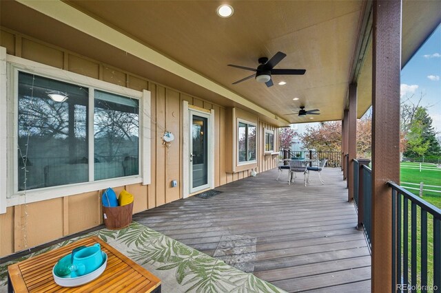 8424 E Otero Cir, Centennial, CO 80112 - wooden terrace featuring ceiling fan and outdoor dining area