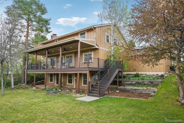 8424 E Otero Cir, Centennial, CO 80112 - back of property with a wooden deck, a ceiling fan, stairway, a yard, and a chimney