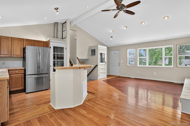 18445 W 59th Dr, Golden, CO 80403 - kitchen featuring freestanding refrigerator, light countertops, ceiling fan, beamed ceiling, and light wood-style flooring