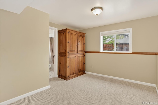 18445 W 59th Dr, Golden, CO 80403 - unfurnished bedroom with light colored carpet and ensuite bathroom