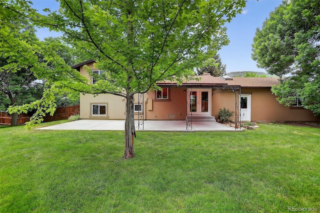 18445 W 59th Dr, Golden, CO 80403 - back of house featuring french doors, stucco siding, and a patio
