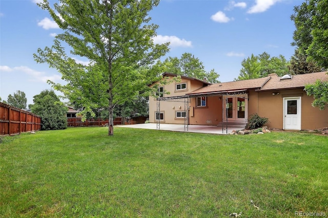 18445 W 59th Dr, Golden, CO 80403 - back of property featuring french doors, stucco siding, and a patio area