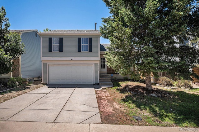 19876 E Brunswick Dr, Aurora, CO 80013 - view of front of house featuring driveway and a garage