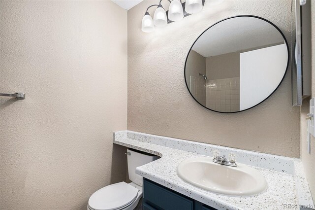 19876 E Brunswick Dr, Aurora, CO 80013 - bathroom with vanity and a textured wall
