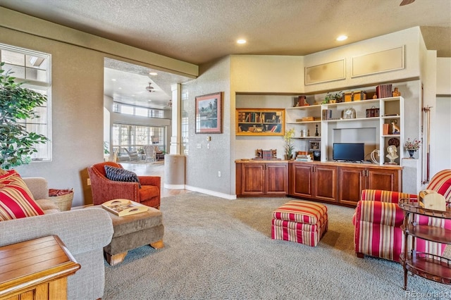 carpeted living room with a textured ceiling