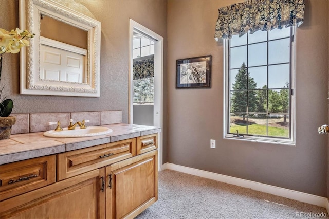 bathroom featuring vanity and decorative backsplash