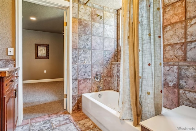 bathroom featuring vanity, a textured ceiling, and shower / bath combo with shower curtain