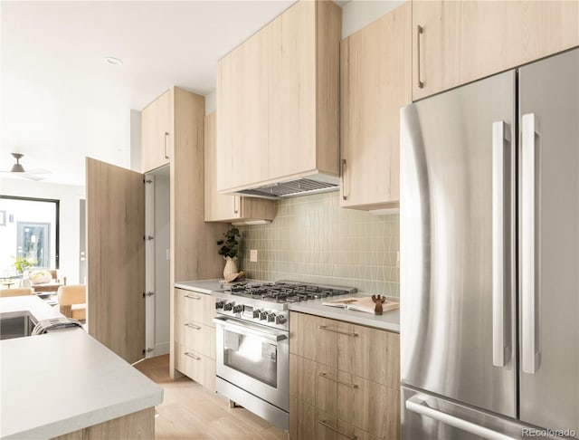 2391 King St, Denver, CO 80211 - kitchen featuring appliances with stainless steel finishes, light brown cabinets, modern cabinets, and light countertops