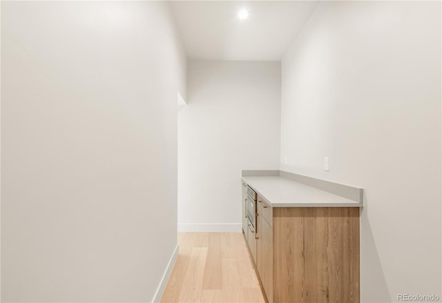 2391 King St, Denver, CO 80211 - hallway featuring light wood-type flooring and baseboards
