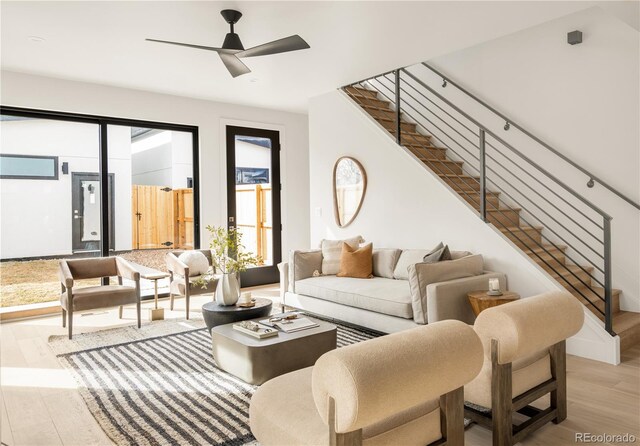 2391 King St, Denver, CO 80211 - living room with stairway, light wood finished floors, and ceiling fan