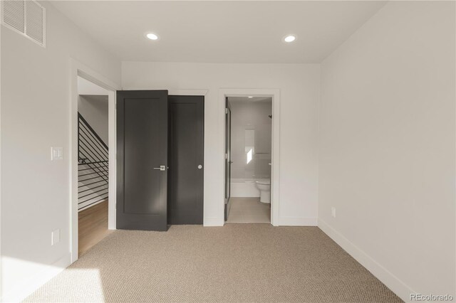 2391 King St, Denver, CO 80211 - unfurnished bedroom featuring light colored carpet, recessed lighting, and ensuite bathroom