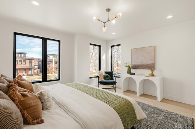 2391 King St, Denver, CO 80211 - bedroom with a chandelier, light wood-style floors, and recessed lighting